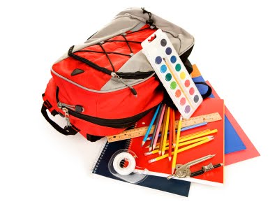 Photo of a backpack with school supplies.