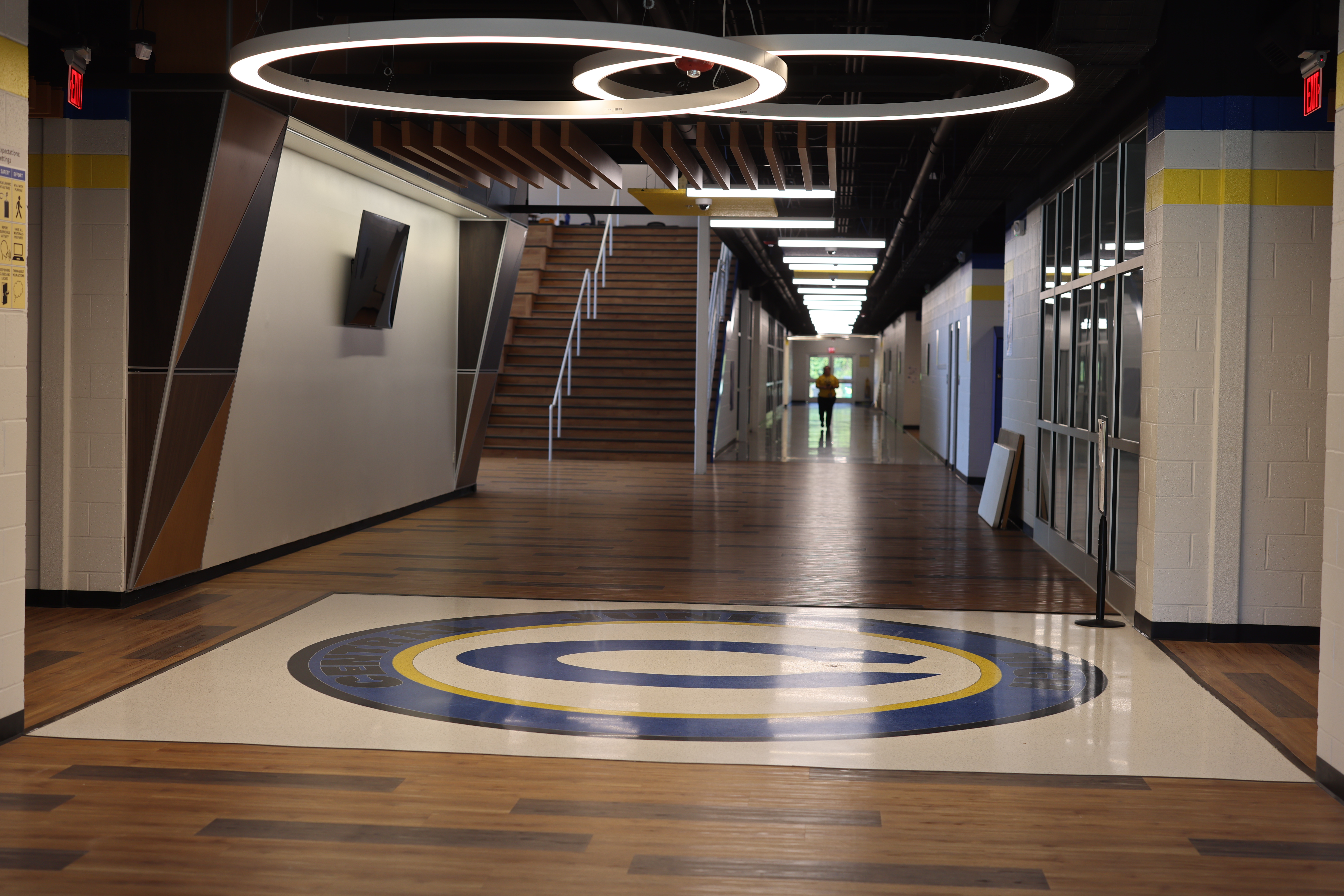 Decorative hallway with Central Jr. High Logo set in floor tiles. Springdale, AR.