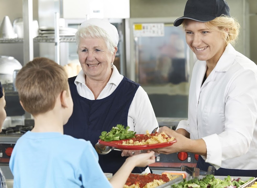 chef giving food to a kid