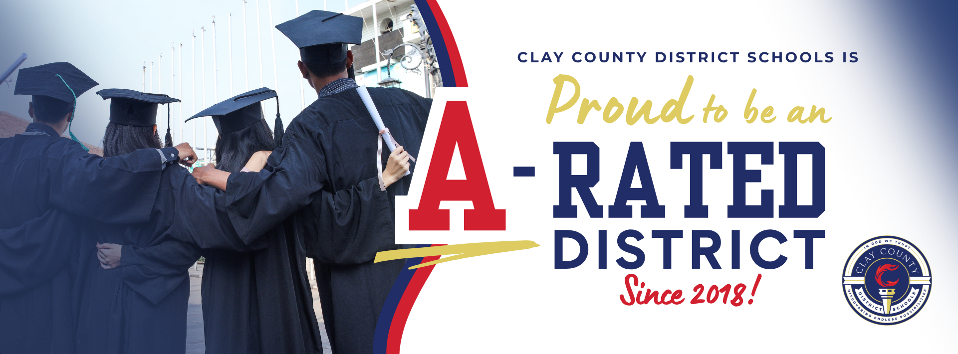 Clay County District Schools announcement banner showing four graduates in caps and gowns from behind, with text that reads: "Clay County District Schools is proud to be an A-rated district since 2018!"