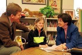 teacher teaching students at a classroom