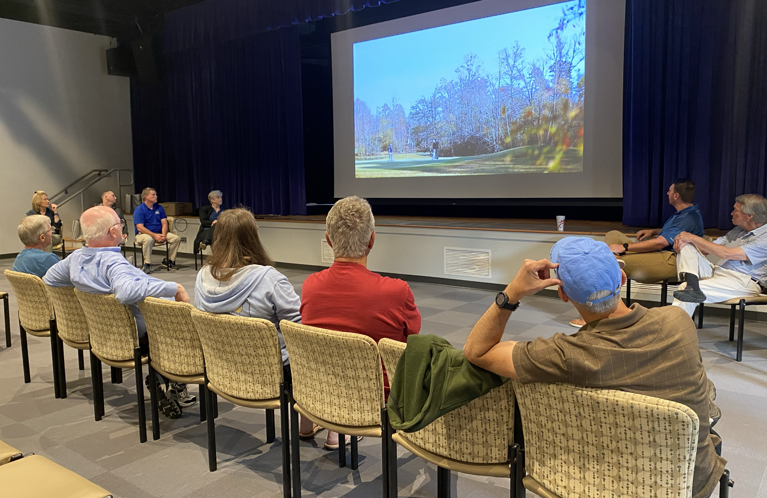 Civics academy students watching video