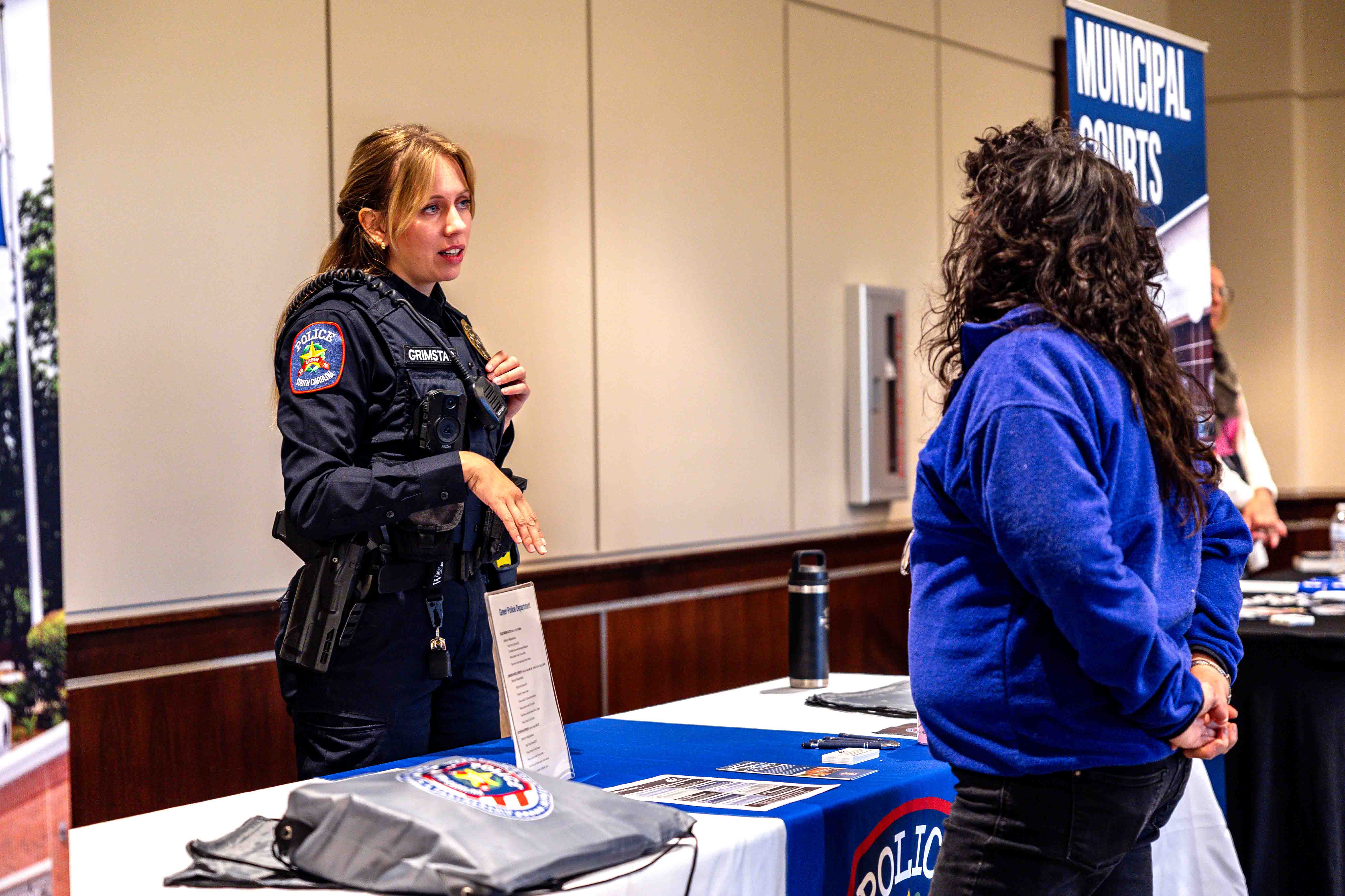 Officer speaking to person at Greer Career Fair