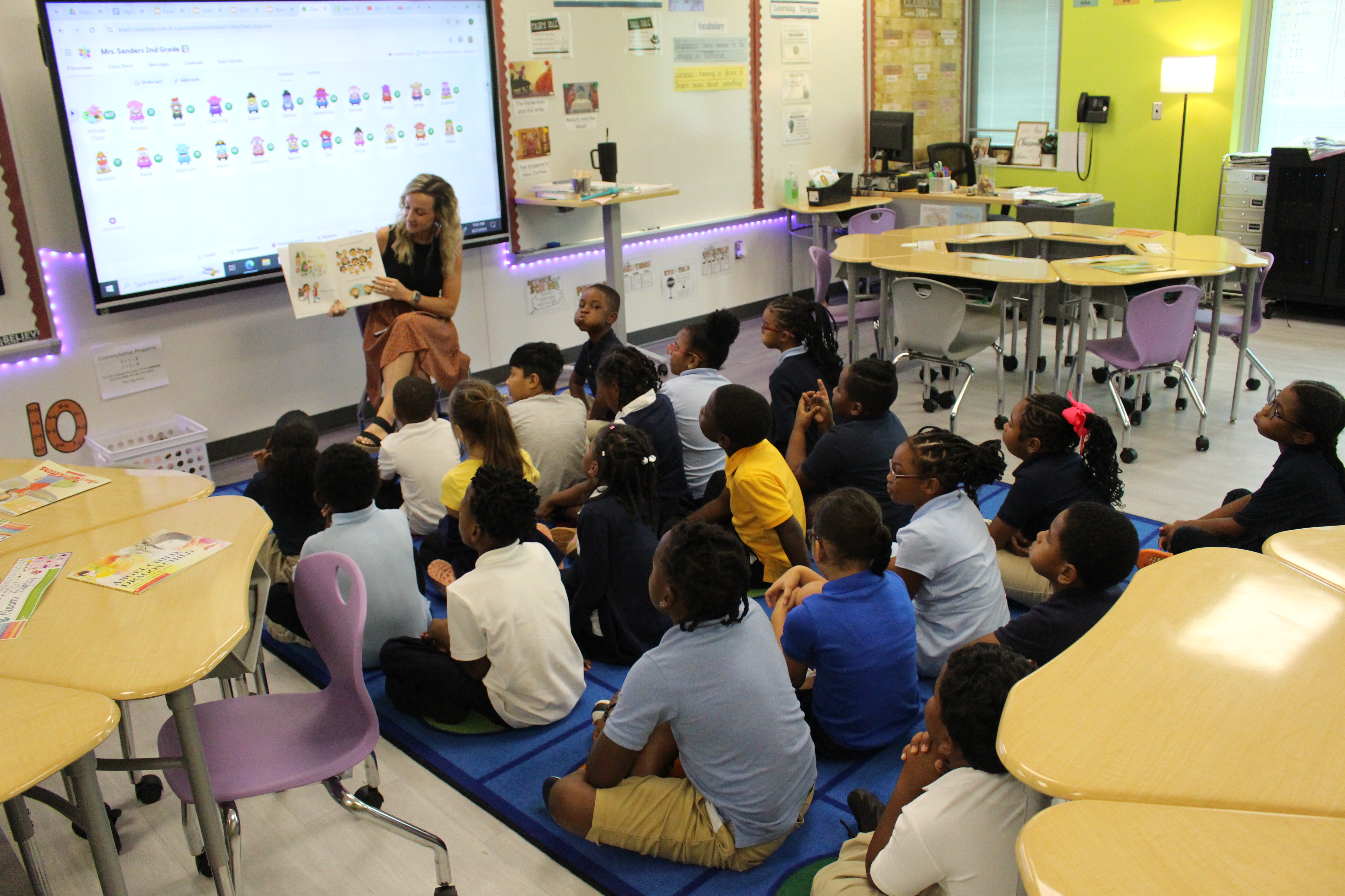 Teacher reading to classroom of students