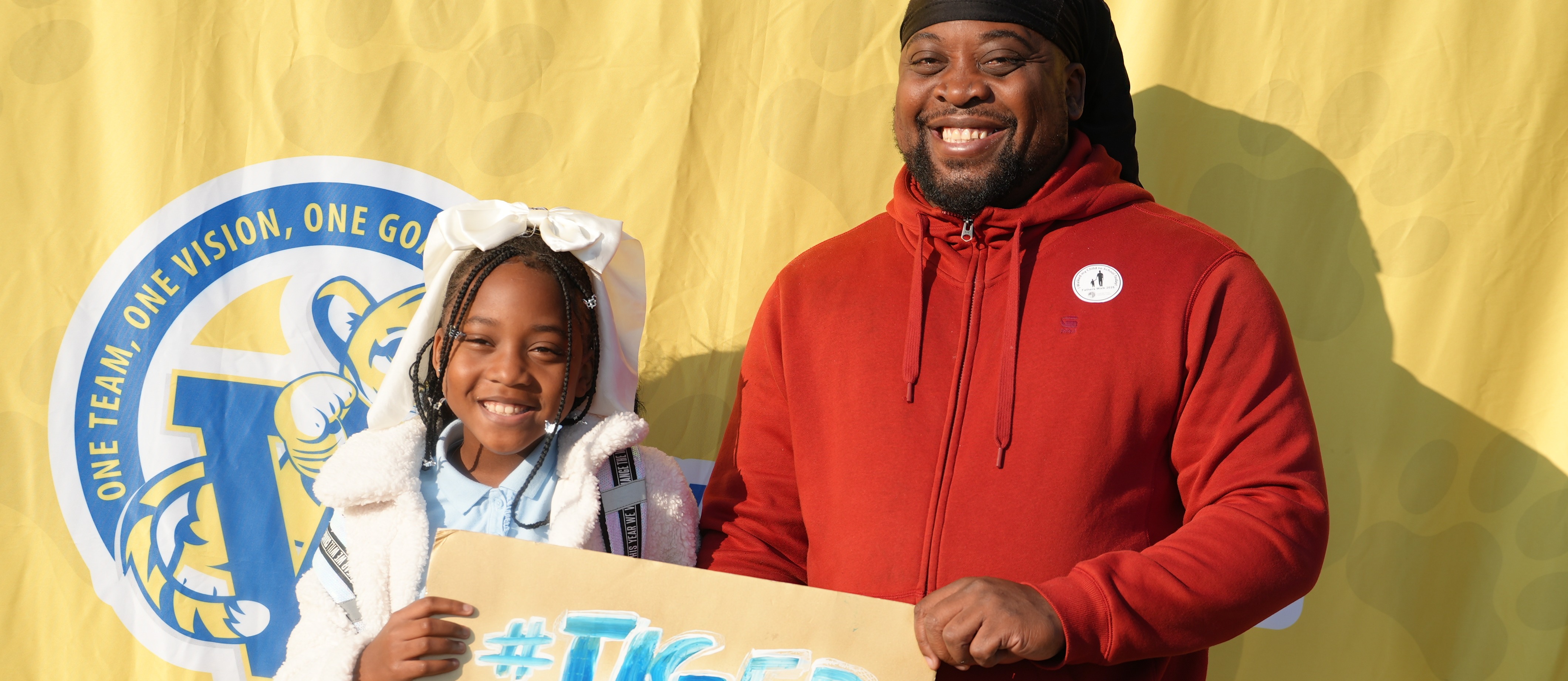 Father and daughter smiling for fathers walk photo