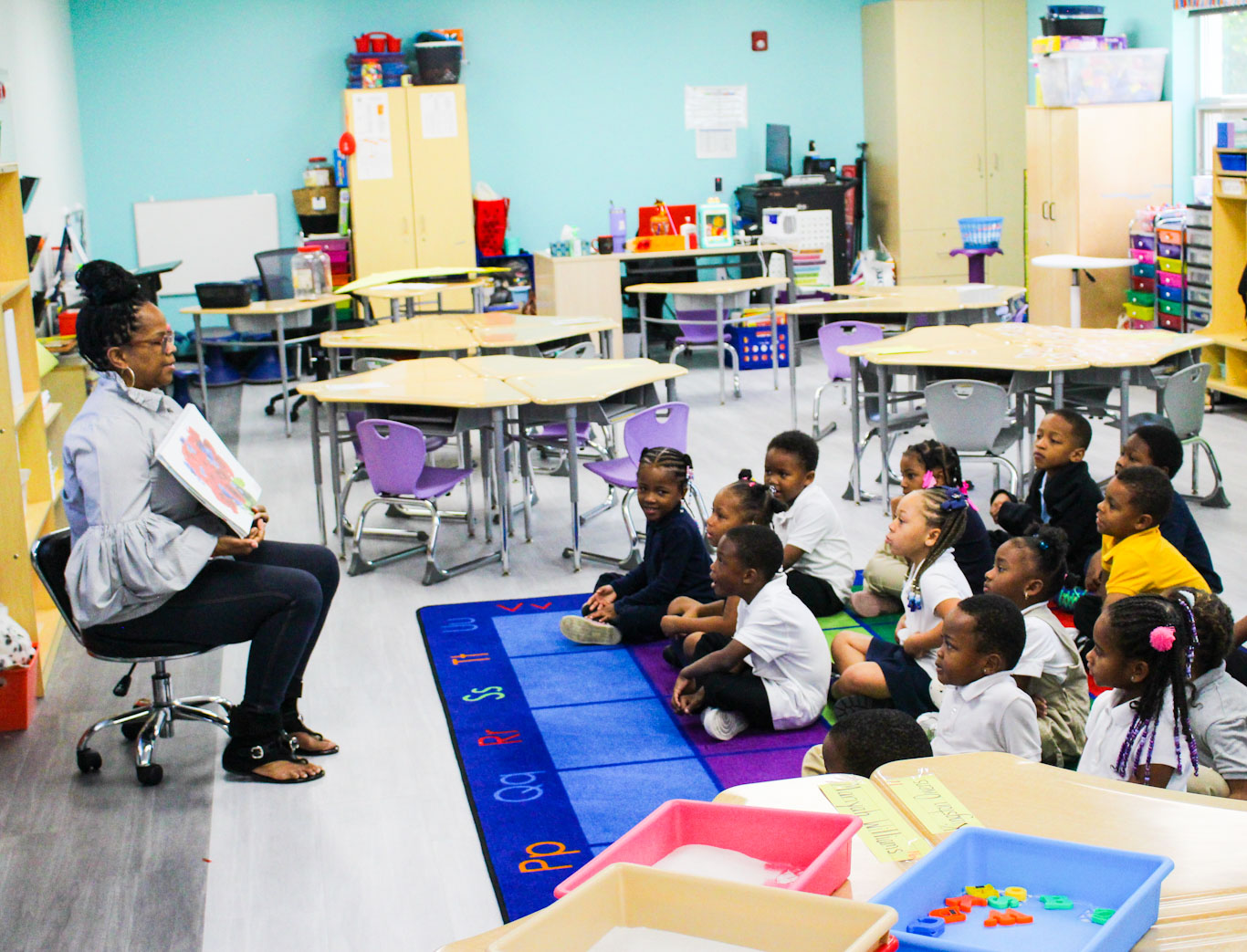 Teacher reading to classroom of students