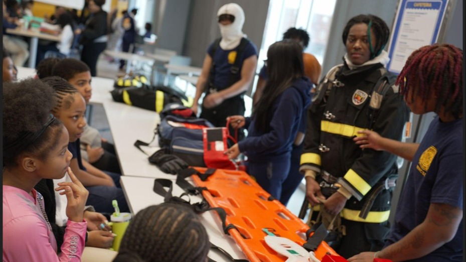 Fire Tech students teach middle school students information about Fire Fighting