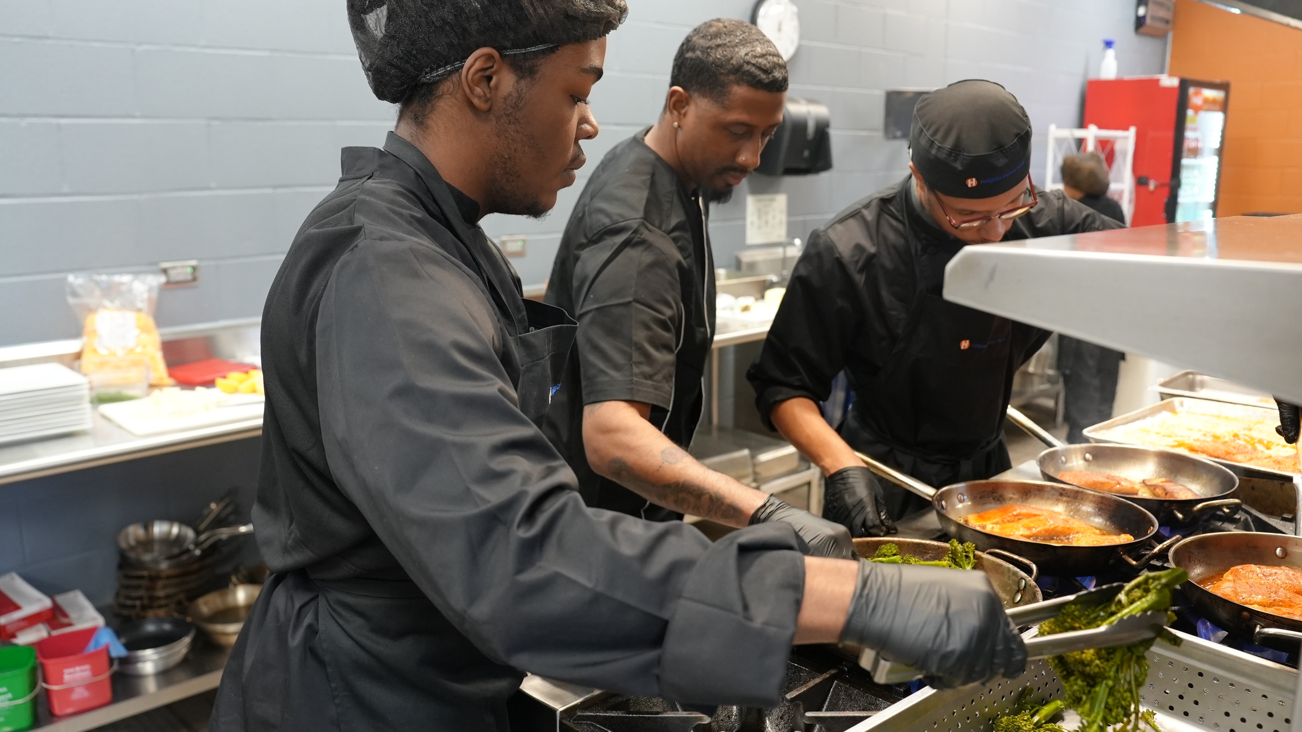picture of culinary students working on food preparation