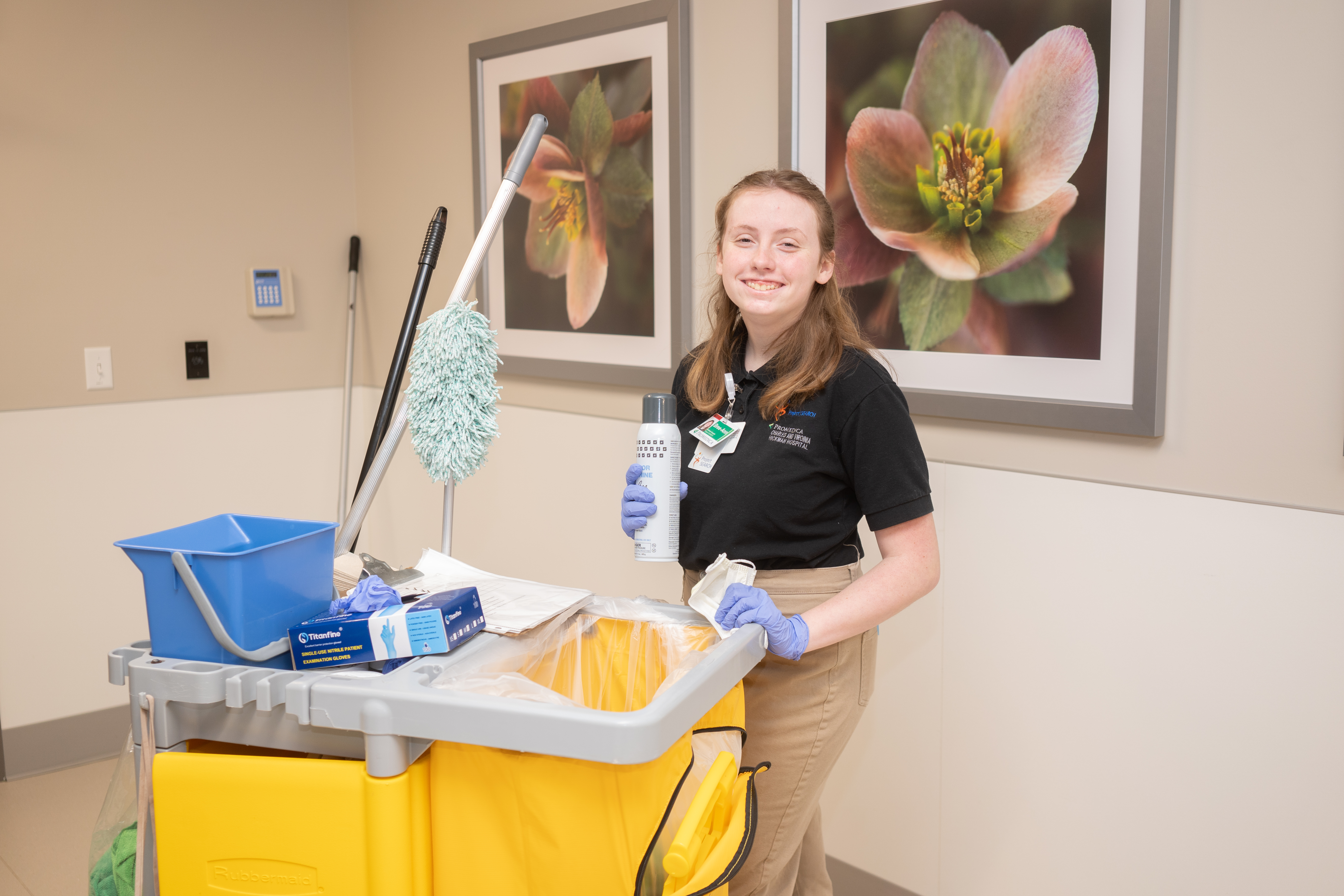 Project SEARCH Intern with cleaning supplies