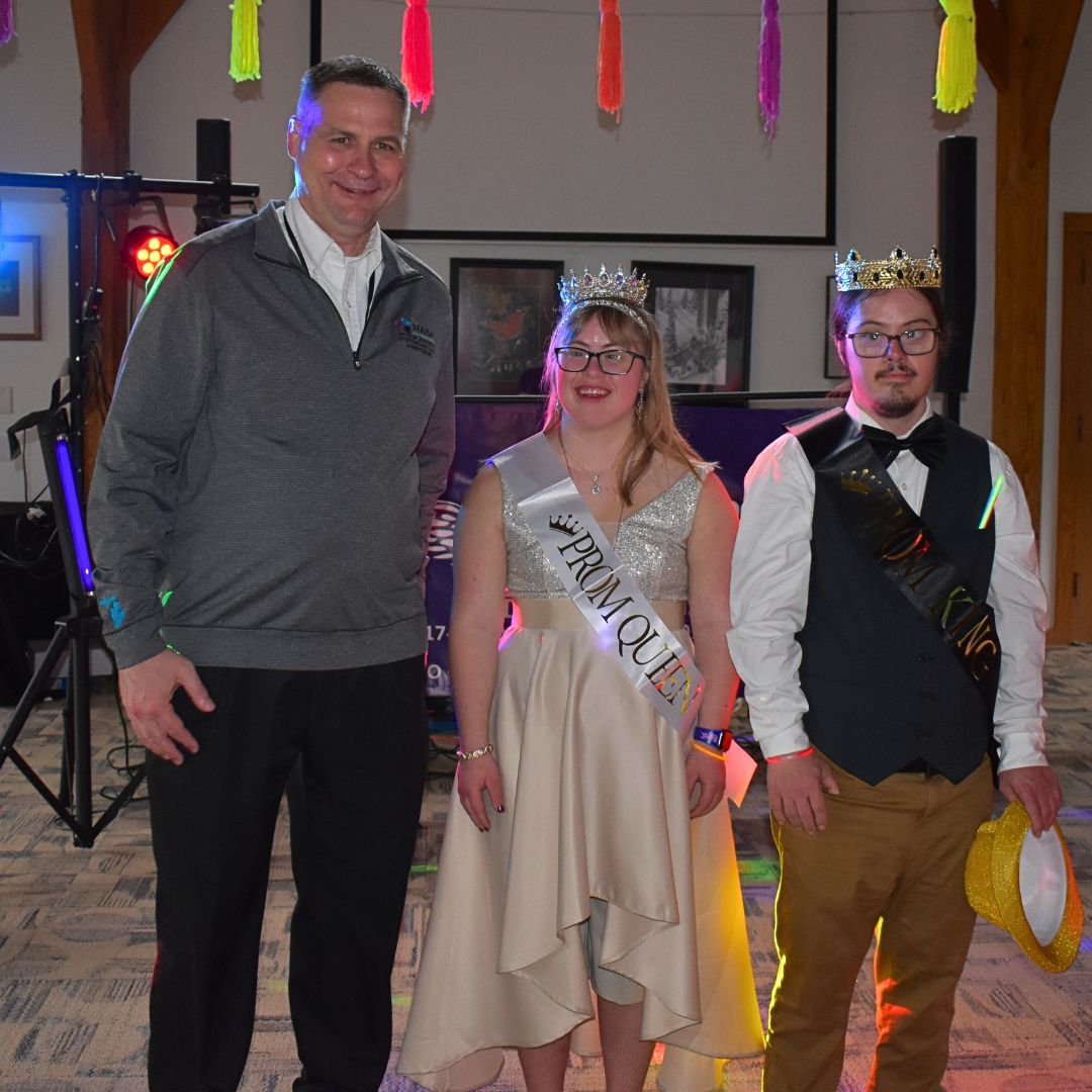 Photo of superintendent, queen and king at prom