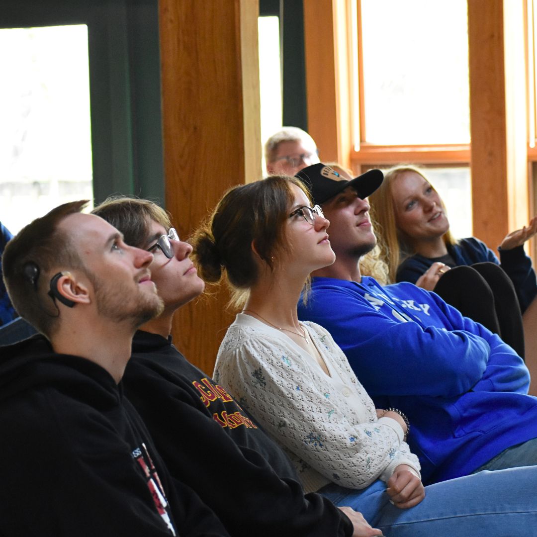 Seniors looking up to watch a slide show
