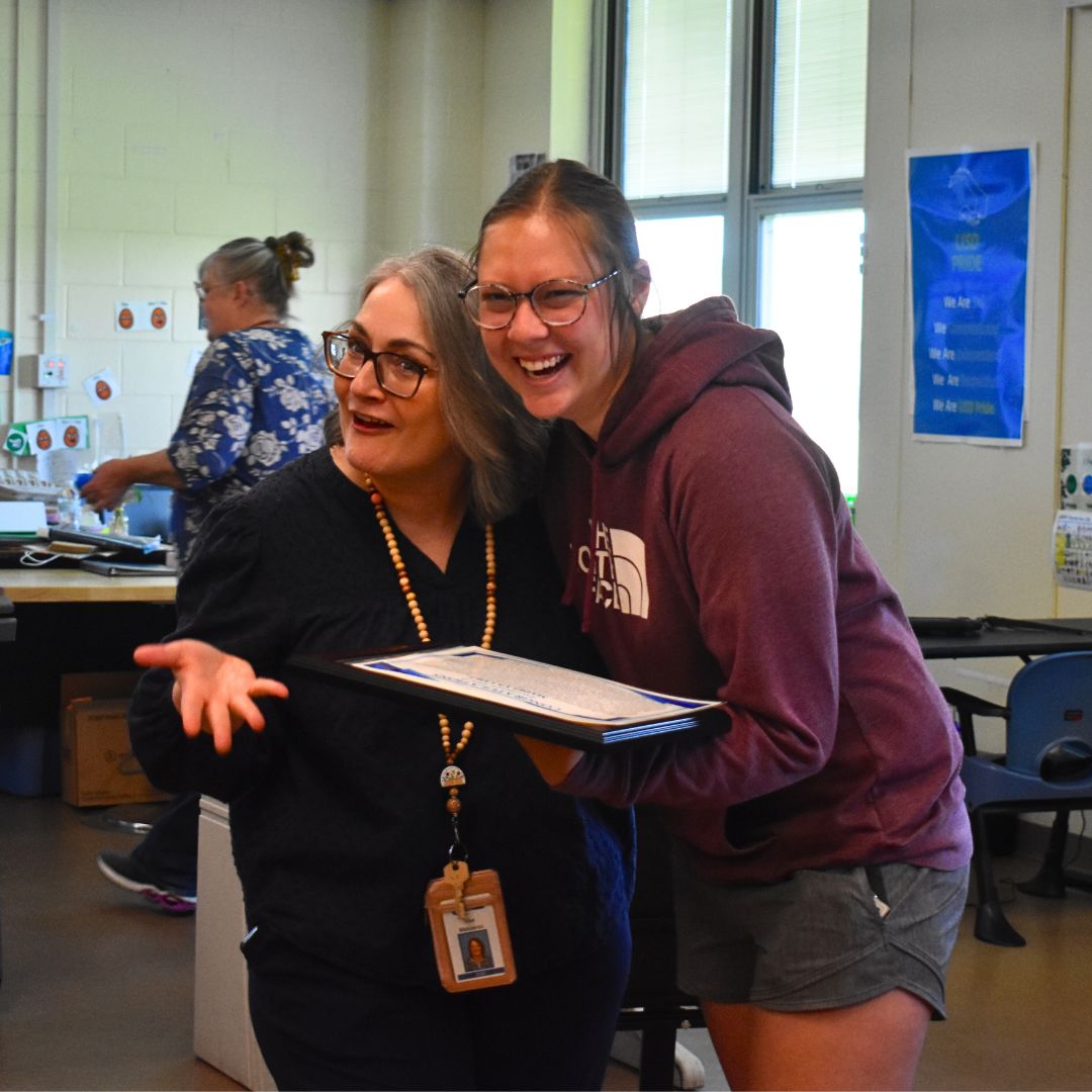 Excellence Award winner giving her supervisor a hug