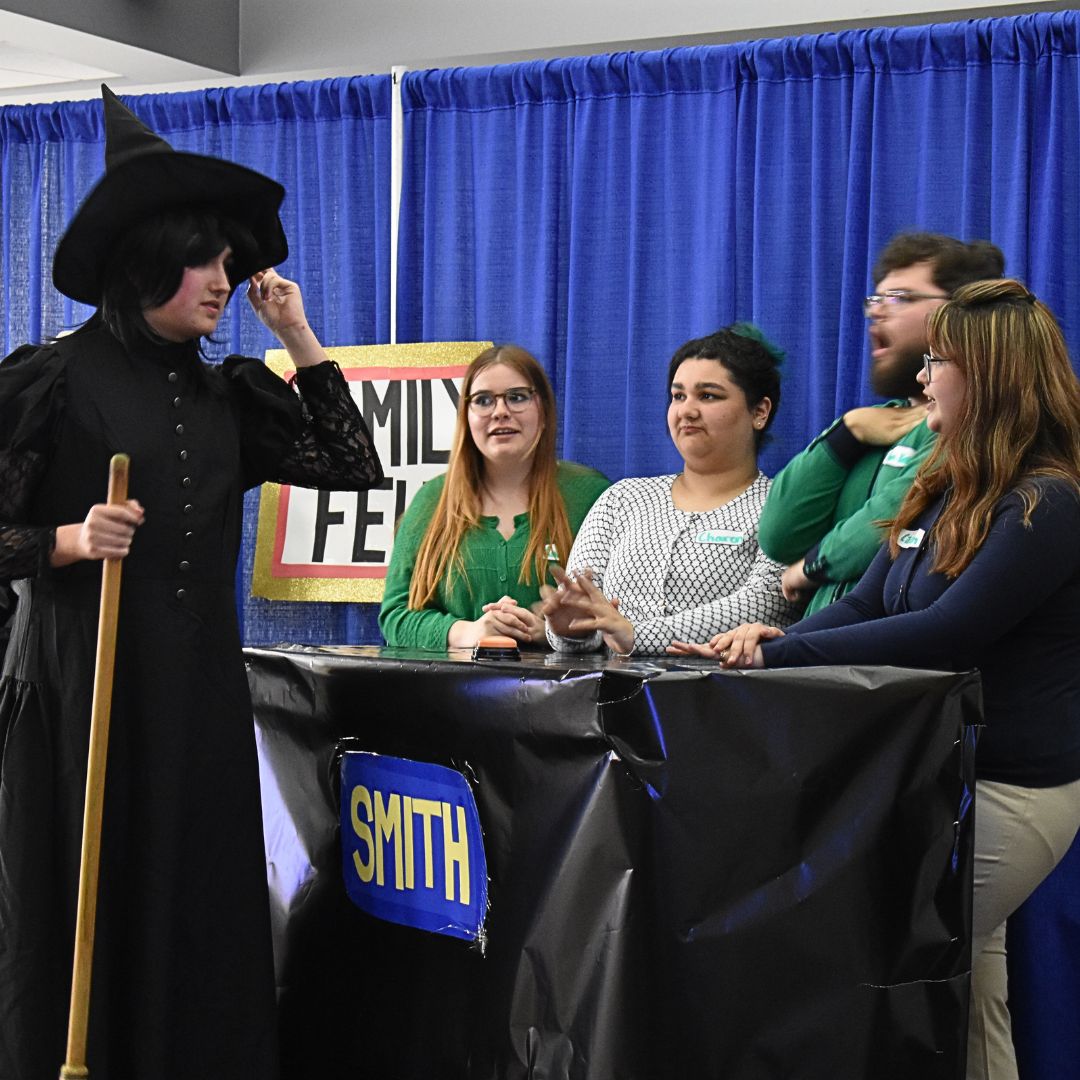 Students acting in an improv show
