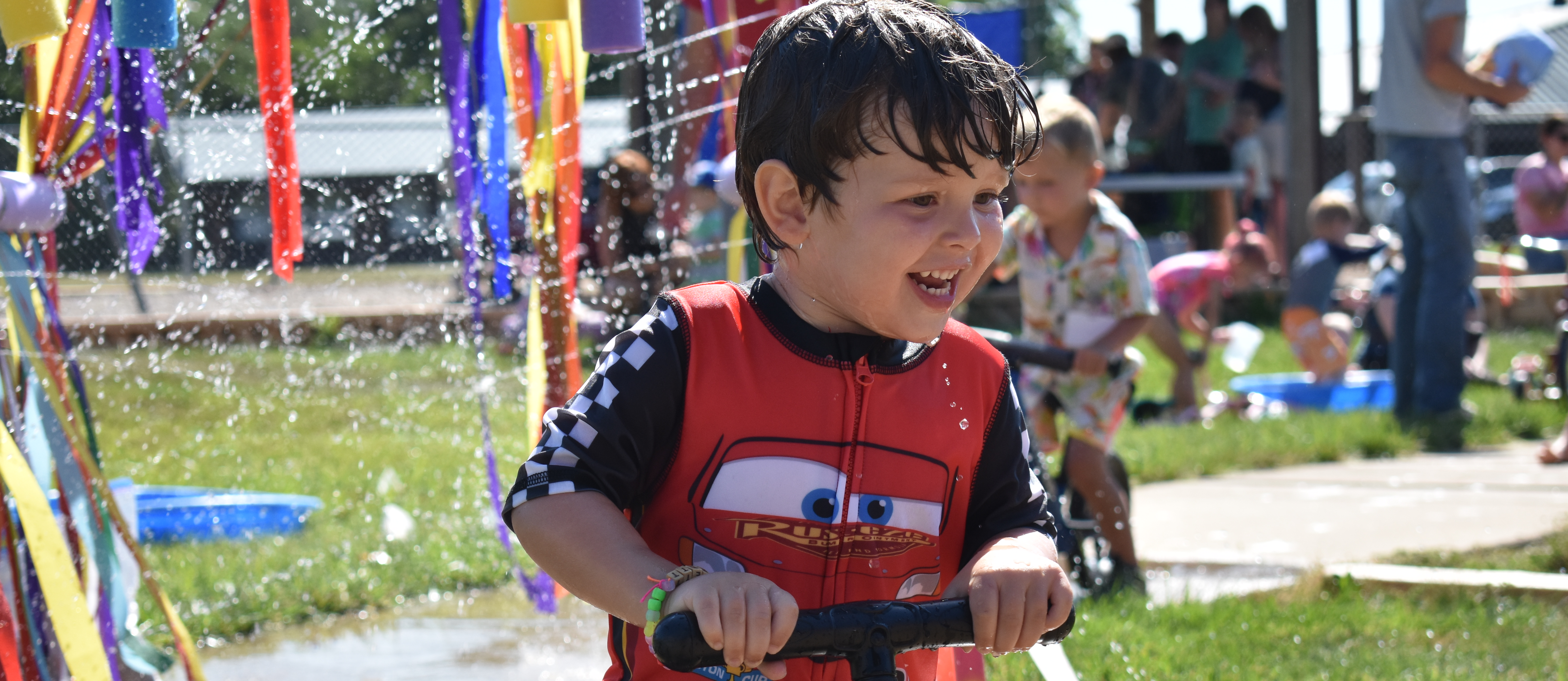 Kid on bike for Preschool Camp
