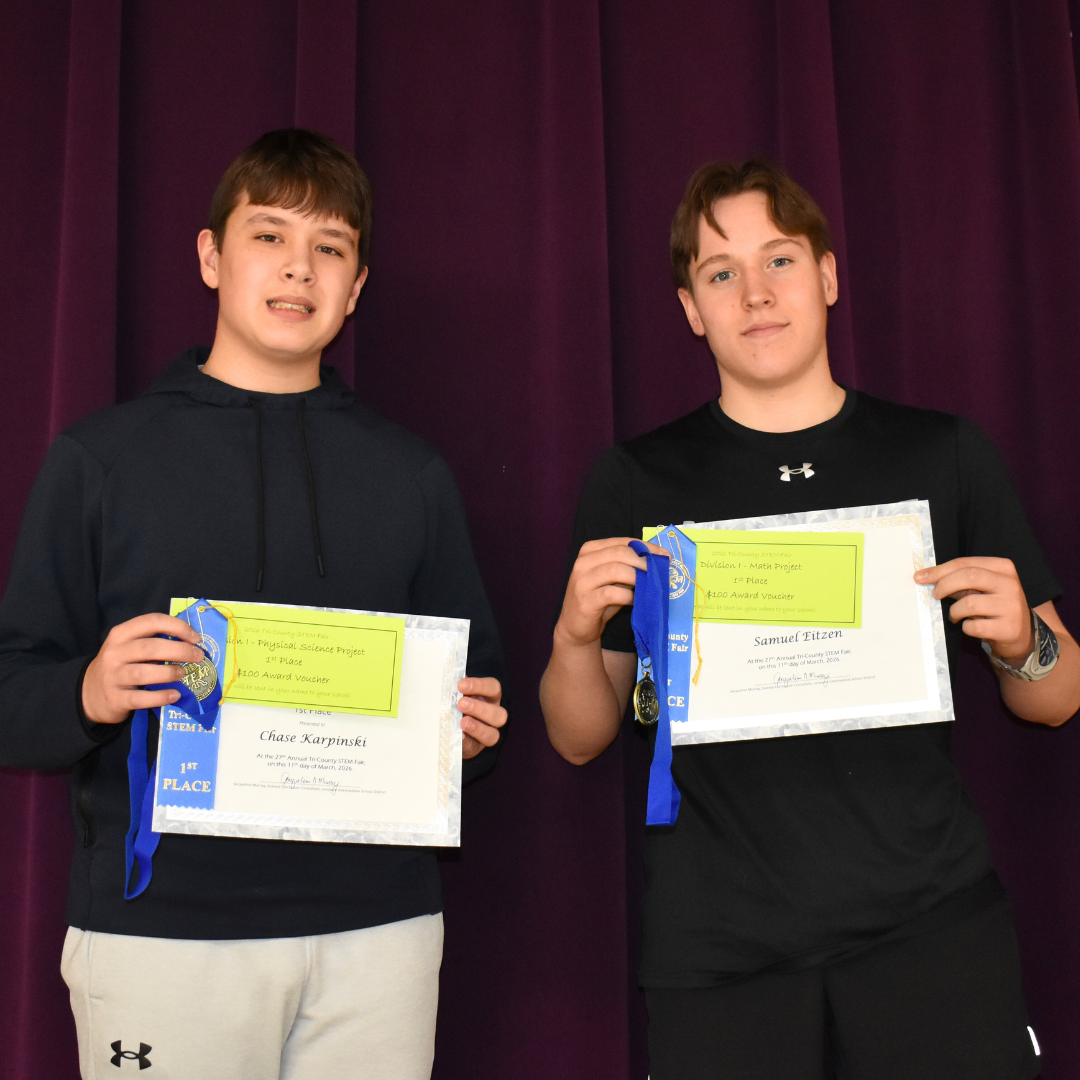 Two students holding their awards from the STEM Fair