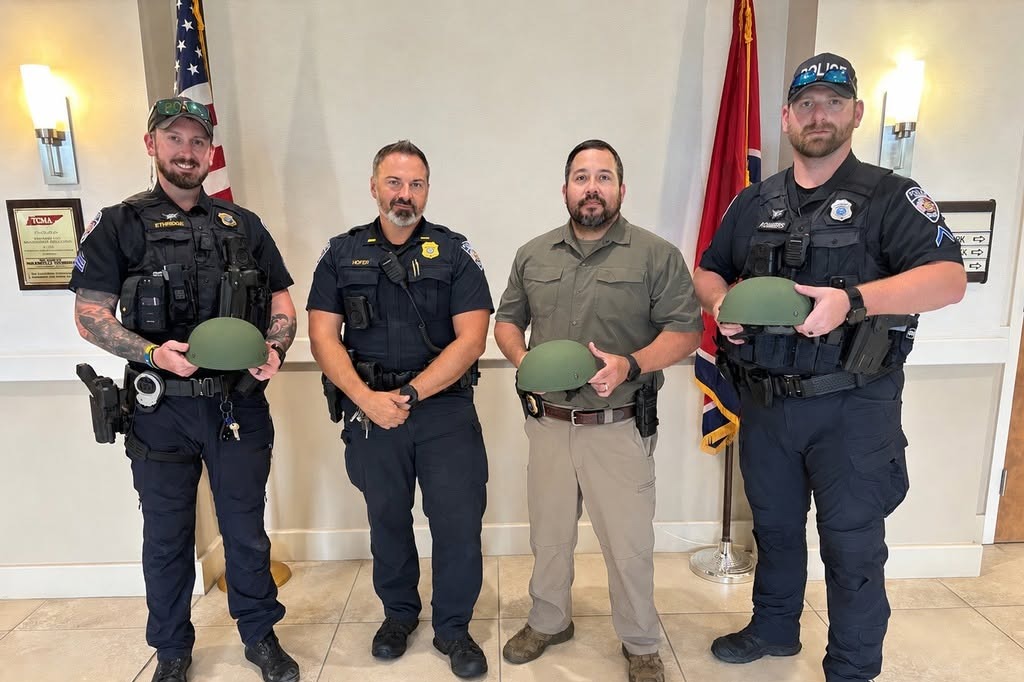 Sgt. Ethridge, Lt. Hofer, Sgt. Duenez, Ofc. Chambers stand in Nolensville Town Hall holding ballistic helmets.