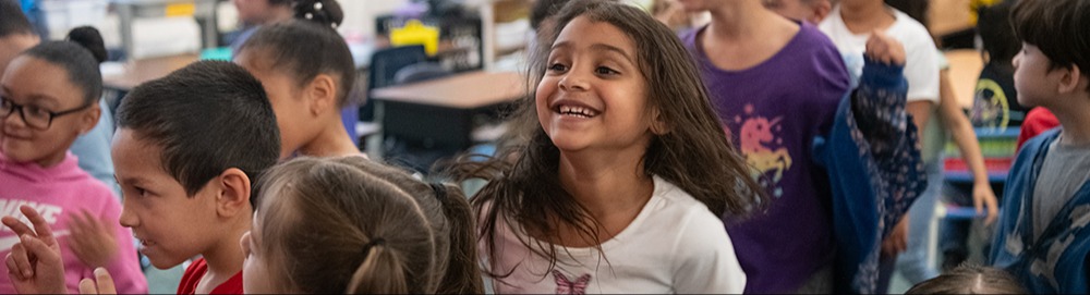 kids sitting listening to teacher