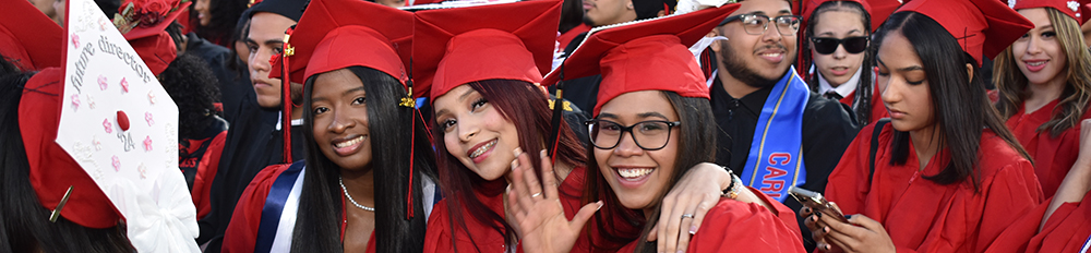 Graduates waving