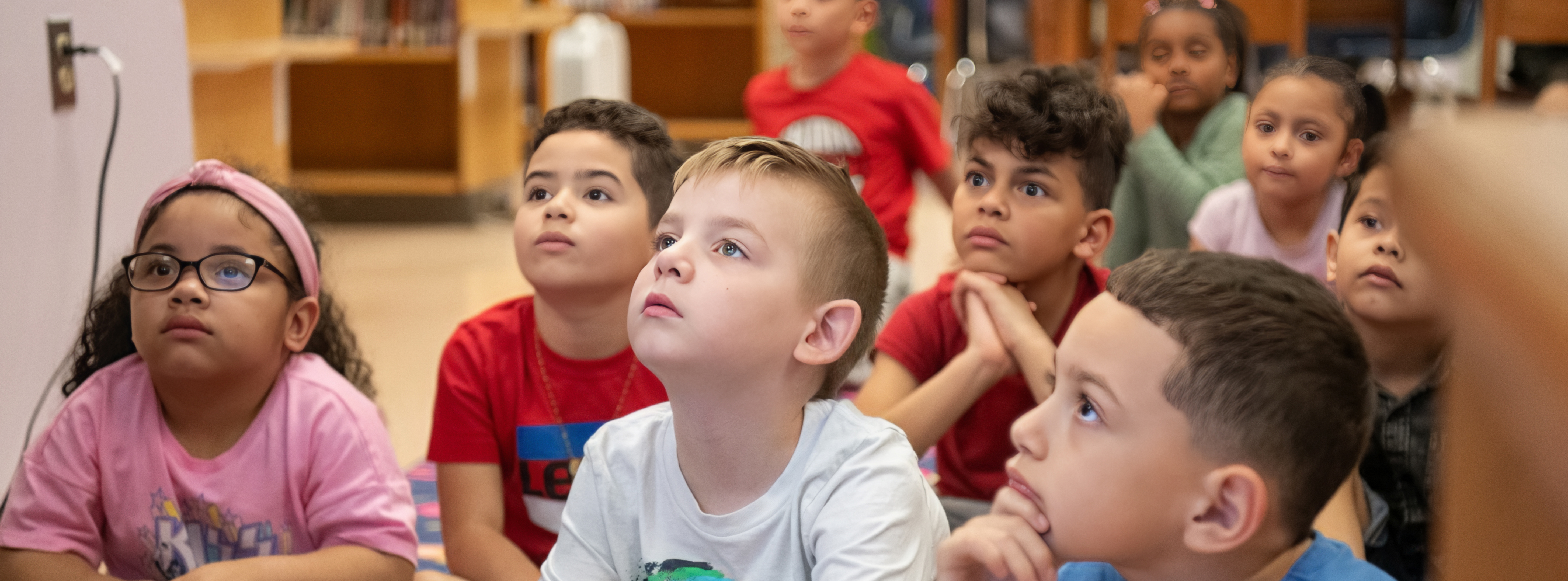 Kids sitting in class listening