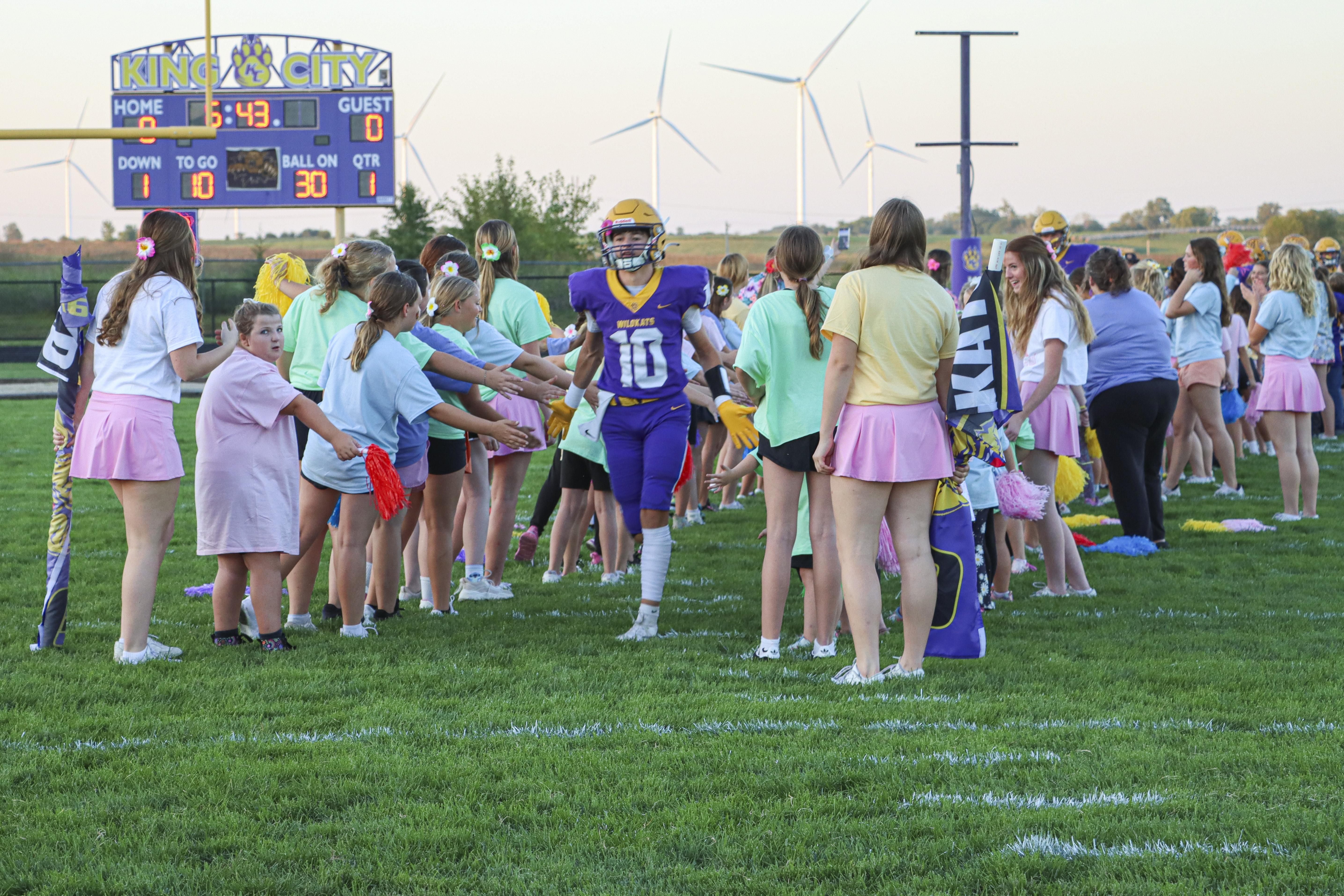 Football player running onto the field