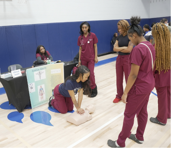 Nursing Clinical health students practicing heart compressions