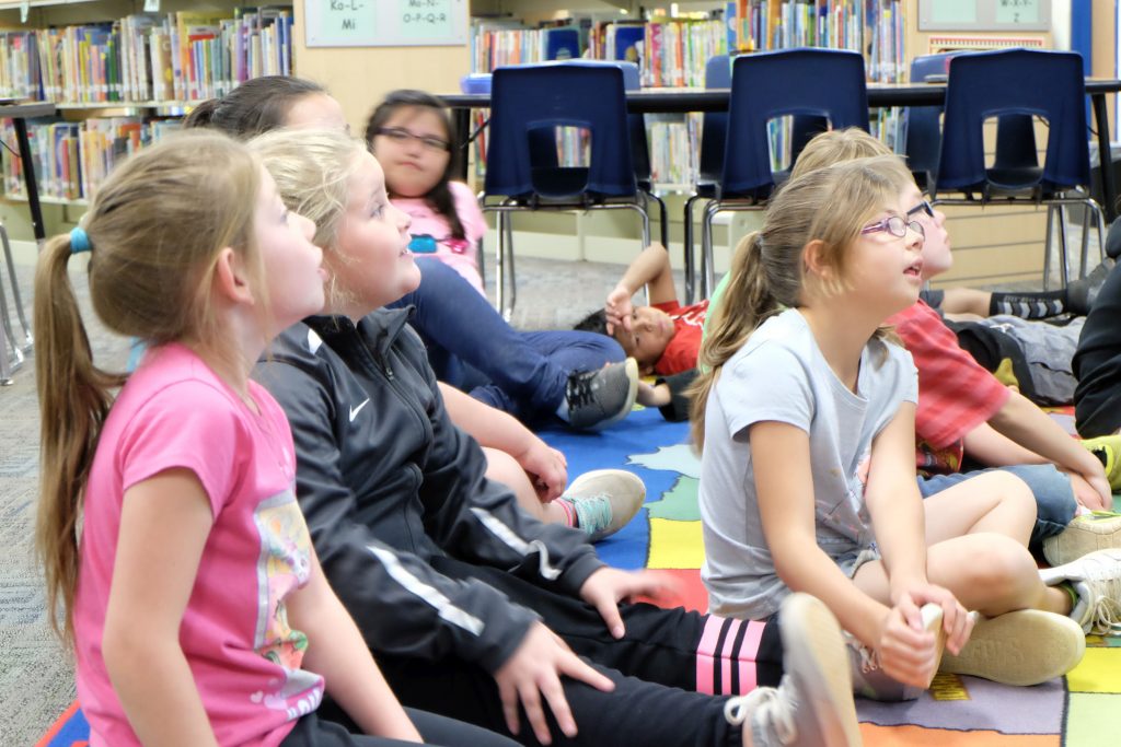 Kids in library presentation