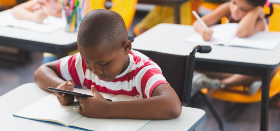 Student in classroom with ipad