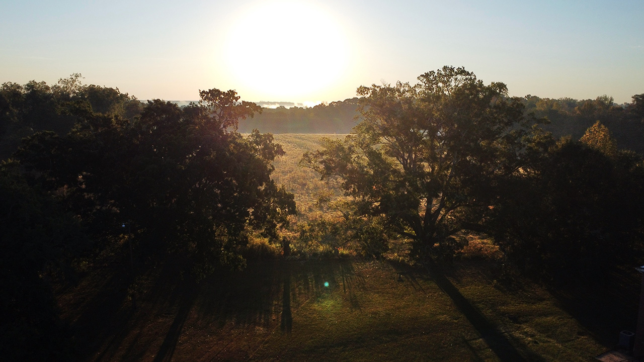 The sun rises over the John de la Howe campus