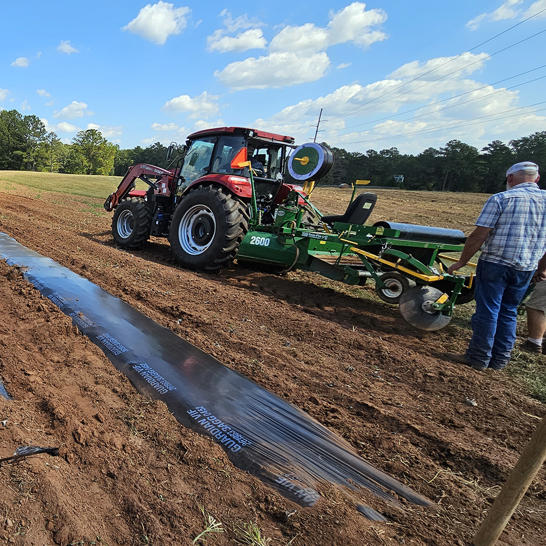 Students use farm equipment to prepare fields for planting. 