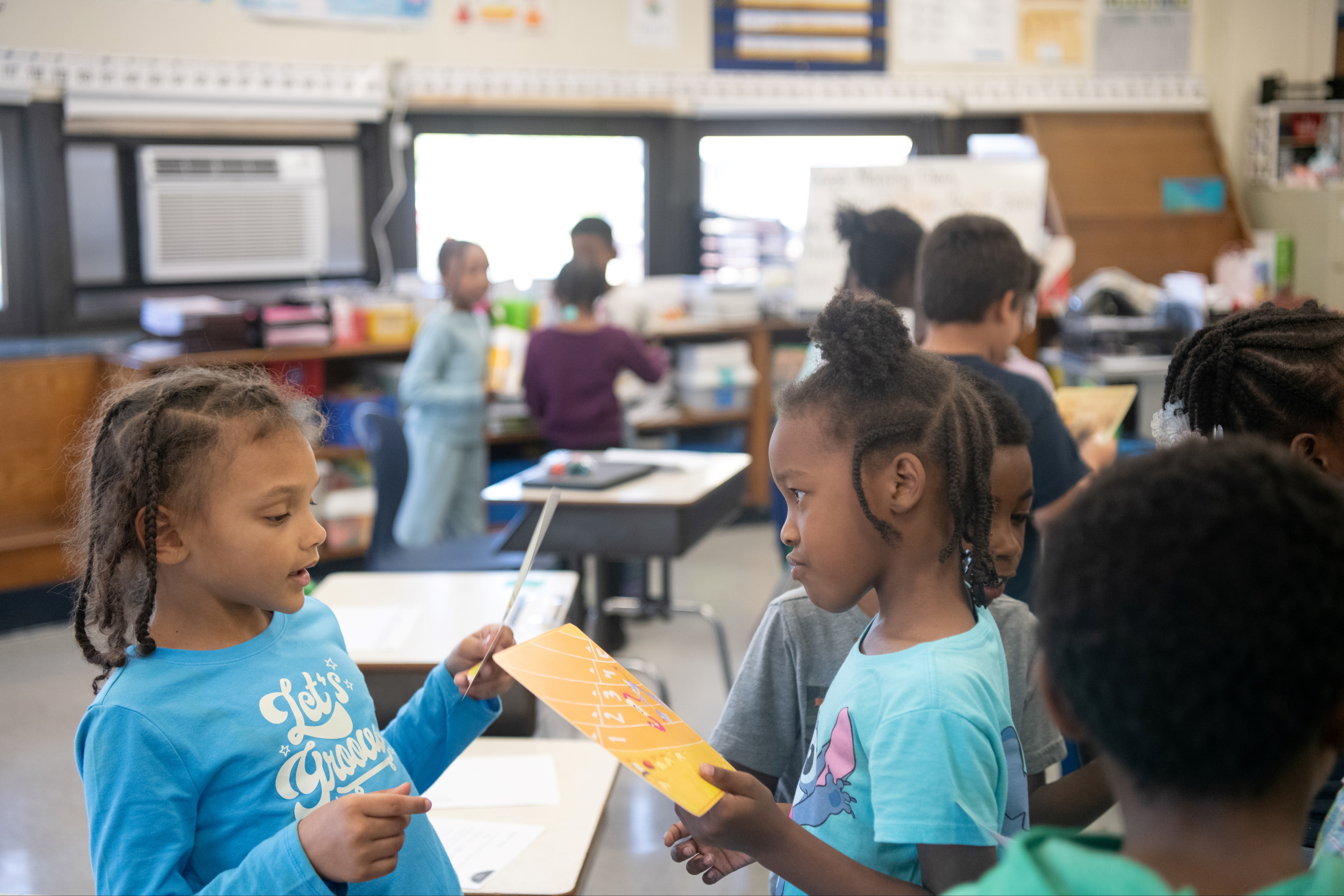 Students looking at pictures and talking