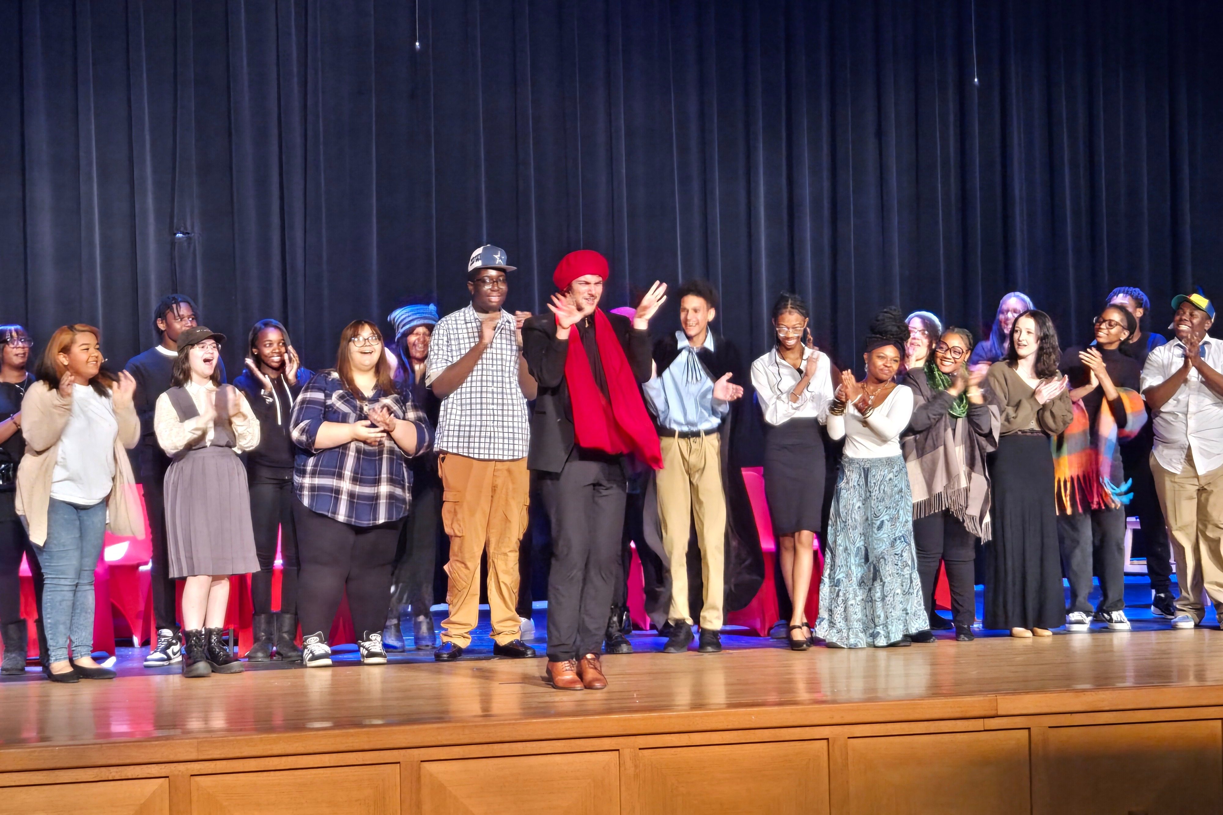 Student Cast of Fall Play standing on stage