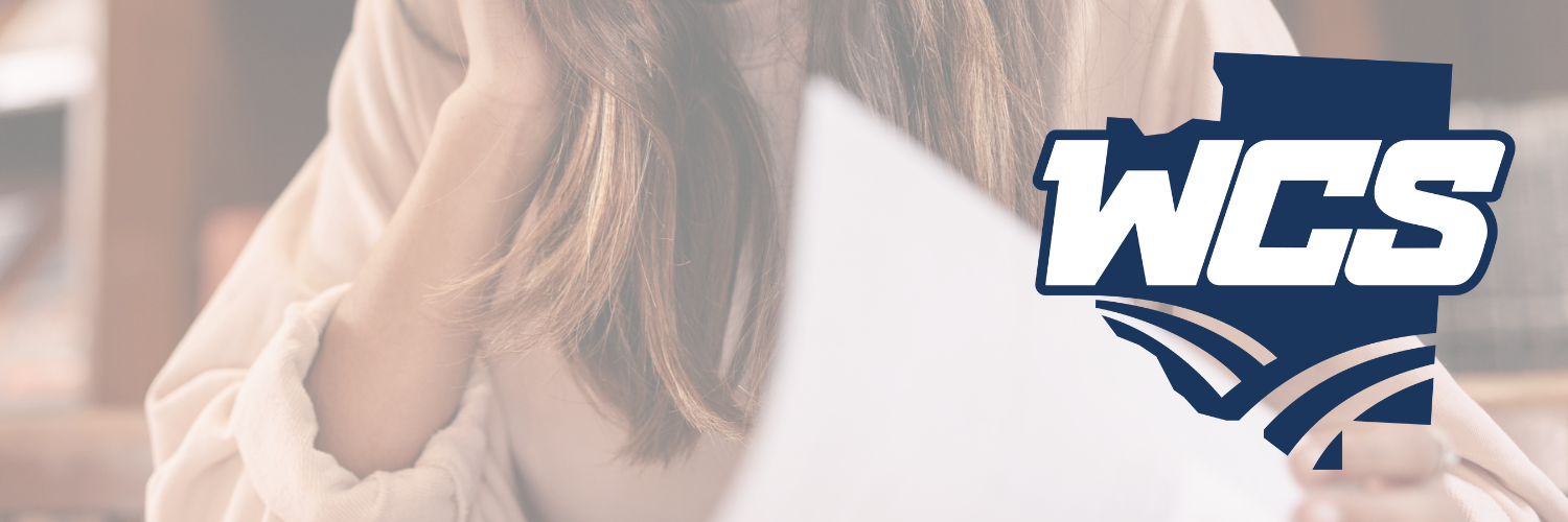 wcs header for free college app week - an image of a student studying with wcs branding over the top