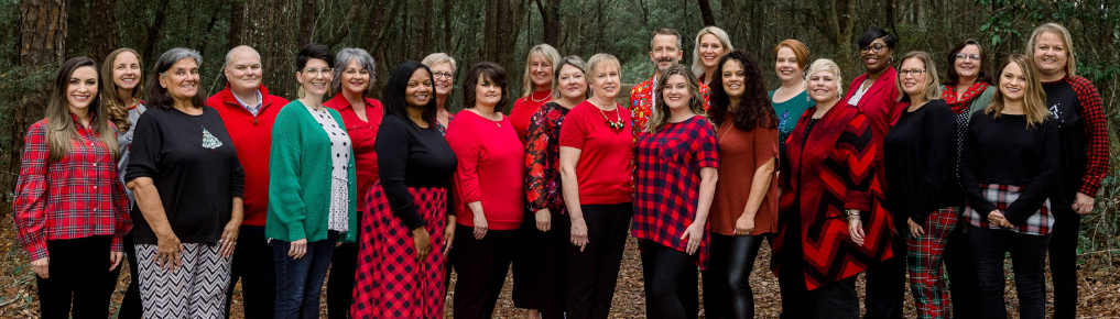 group of teachers together smiling 
