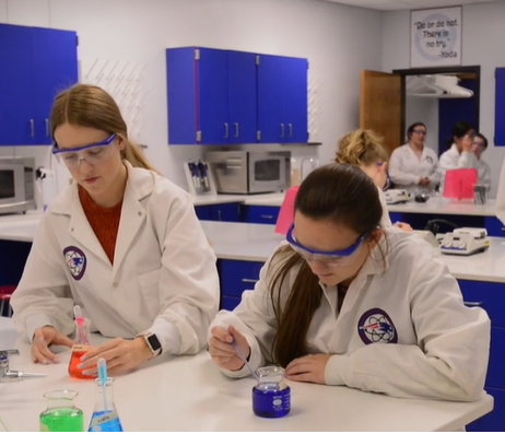 Two students performing tests in Biotechnology