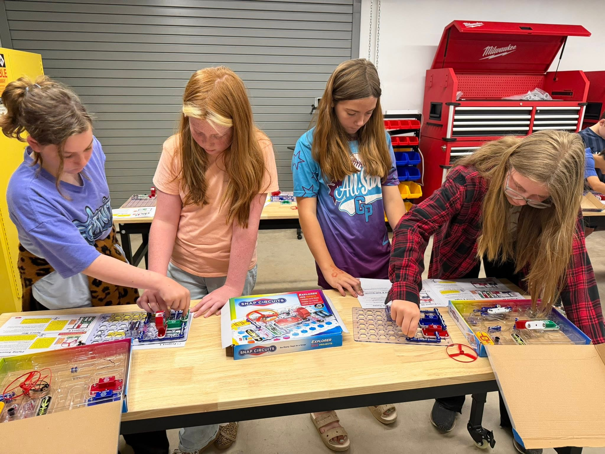 Four girls building Snap Circuits