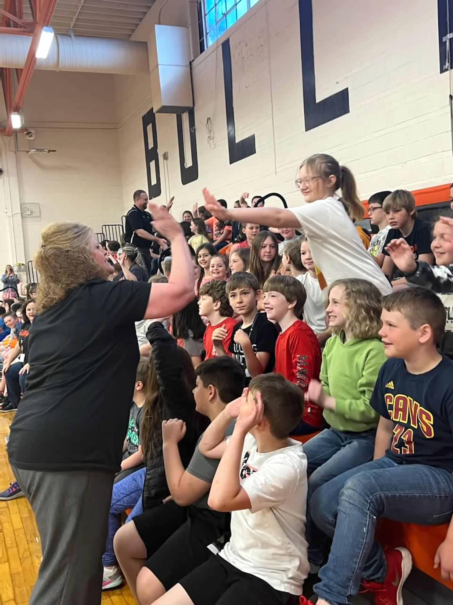 Gleason students high fiving in the gym