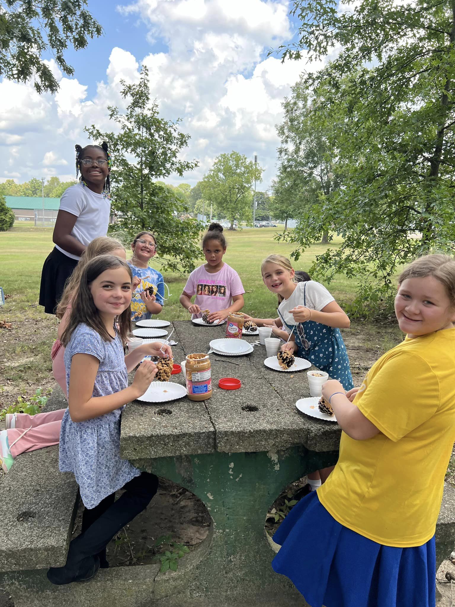 MES students at a picnic table outside