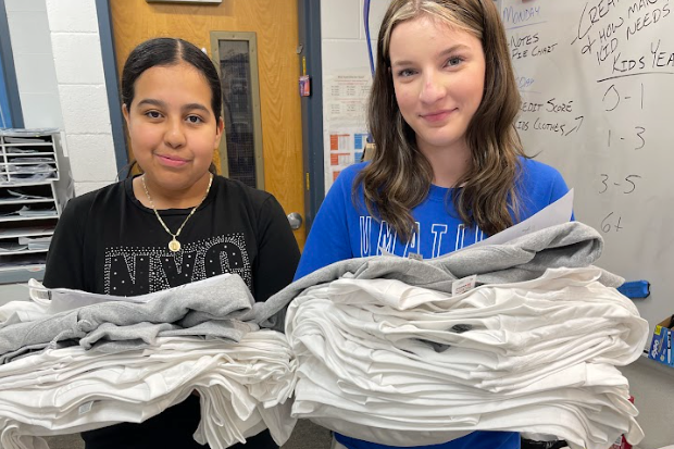 Photo of Viking Production Students holding shirts 2022-23