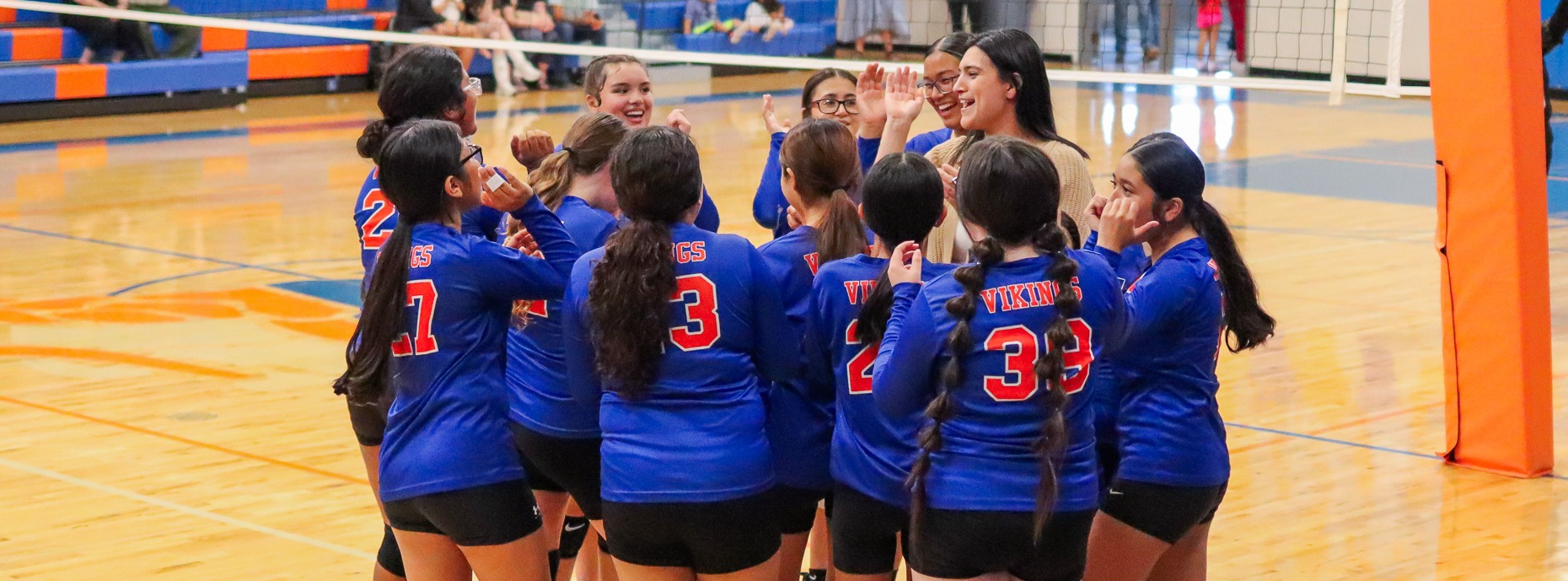 CBMS Volleyball Team cheering in group huddle 2025-2026