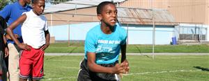 students practicing football