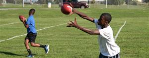 students practicing football