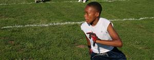 students practicing football