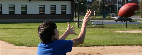 students practicing football