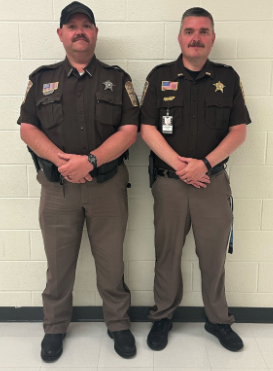 two officers posing for a picture