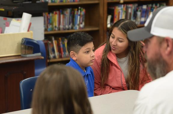 student talking with his mom