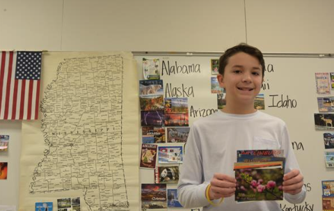 student smiling at the camera