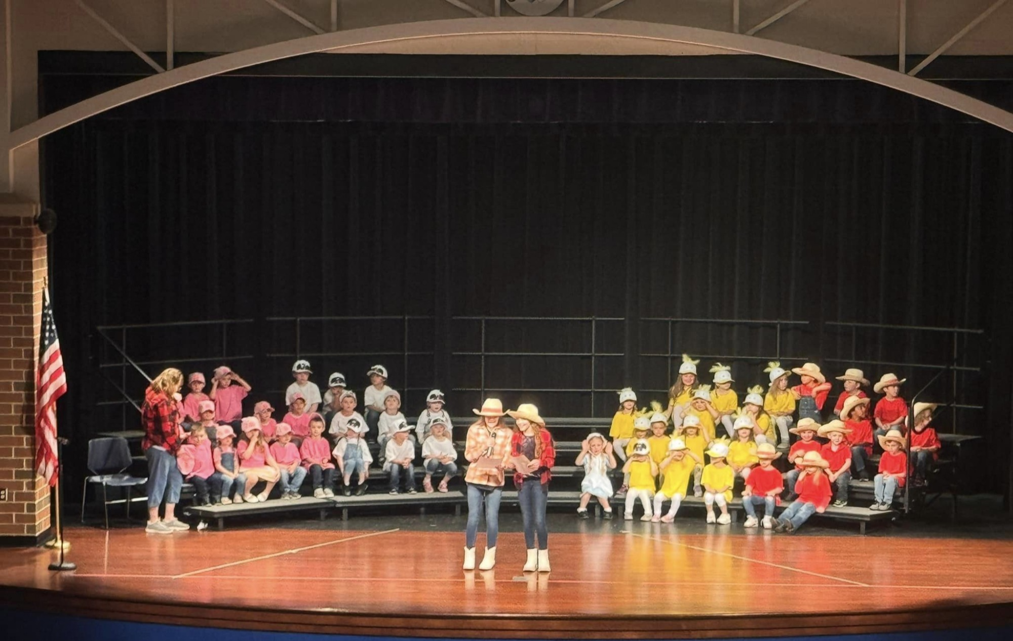 pre k students in grades with hats and caps