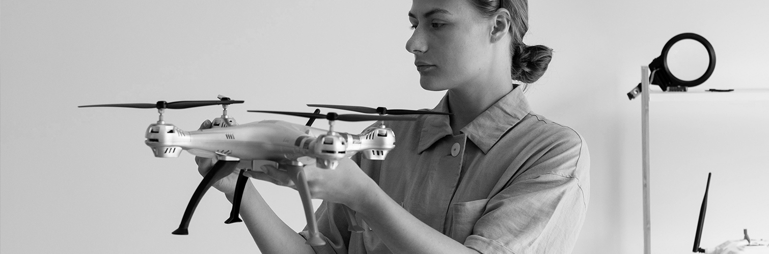 A person assembling a drone, focusing on the task at hand.
