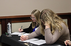Two girls taking an exam
