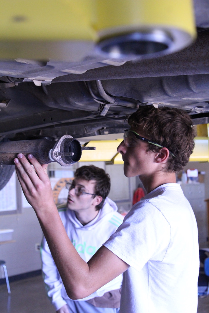 Students working in a car